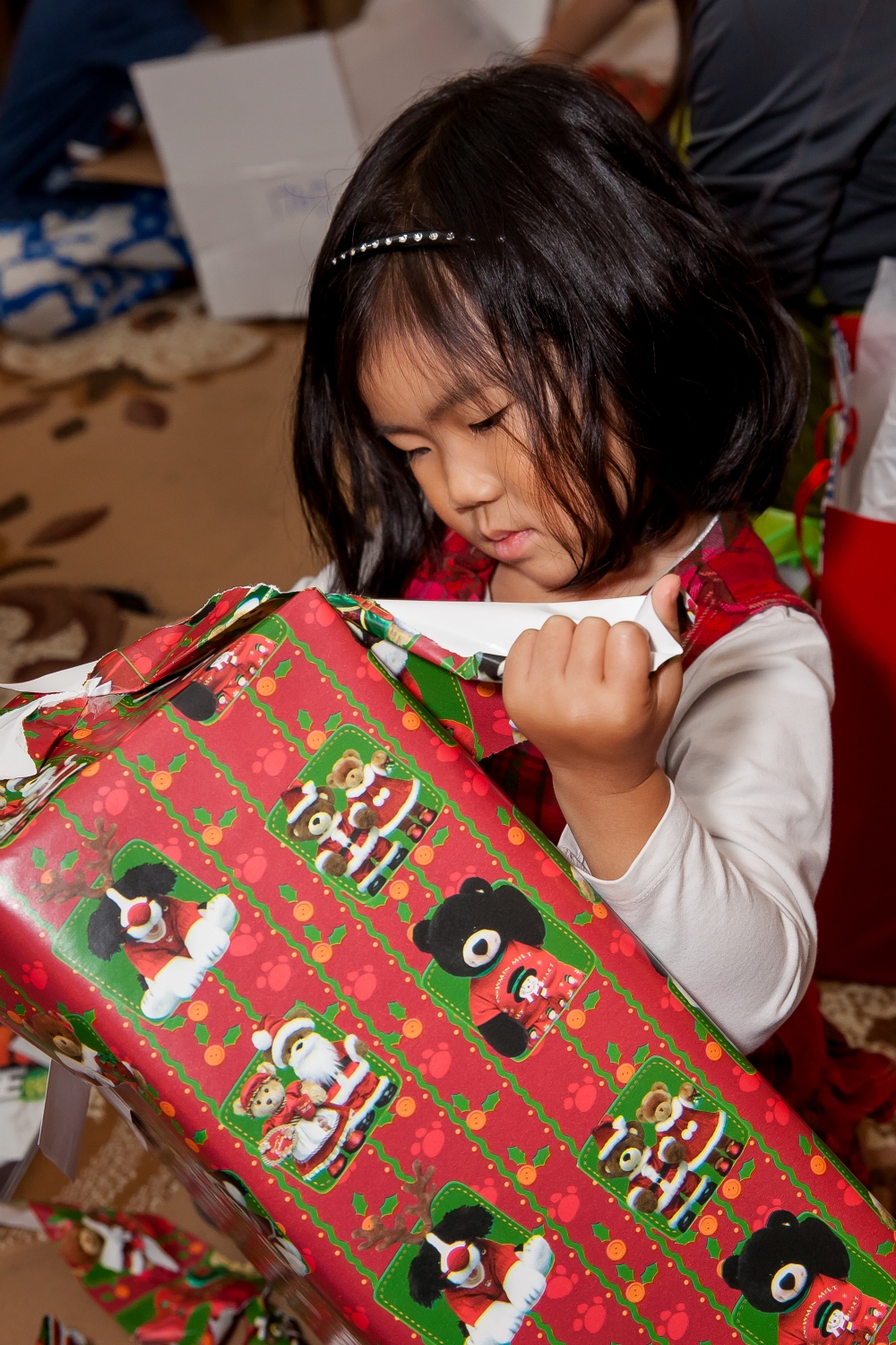 Opening Christmas gifts on New Year's Eve